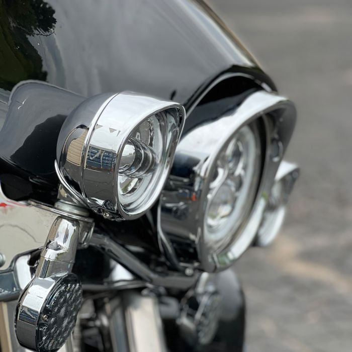 Chrome Passing Lamp Visor Trim Rings pair from HOGWORKZ on an Ultra Classic side view
