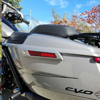 Color Matched Saddlebag Latch Covers on Harley® CVO red reflector