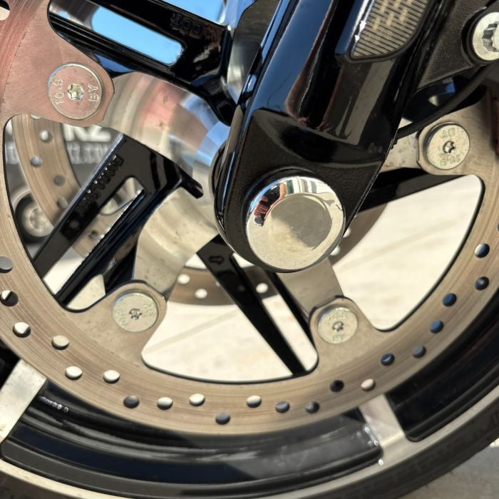 Chrome HOGWORKZ® Front Axle Covers for Harley® Touring close up