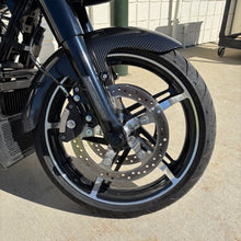 Black HOGWORKZ® Front Axle Covers for Harley® Touring on bike