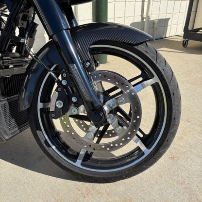 Black HOGWORKZ® Front Axle Covers for Harley® Touring on bike