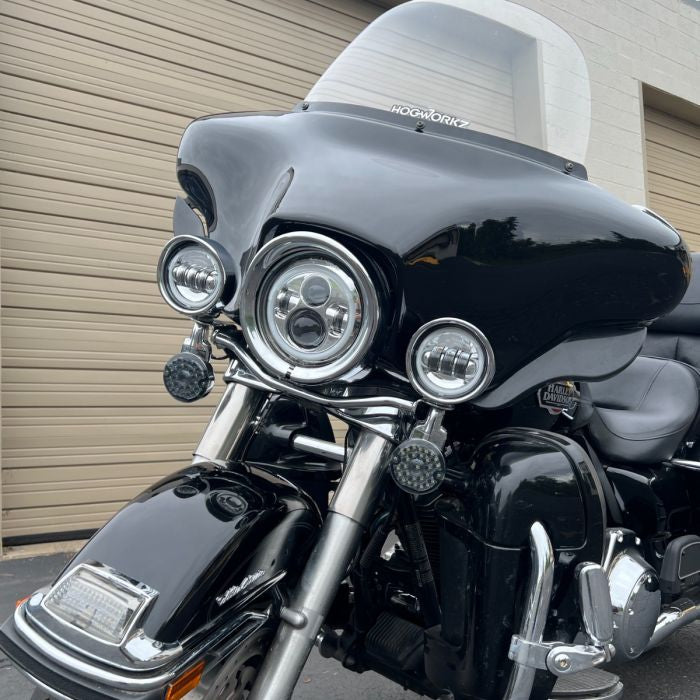 Chrome-plated visor style headlight trim ring. Direct bolt-on install for 7" headlight from HOGWORKZ on electra glide front v